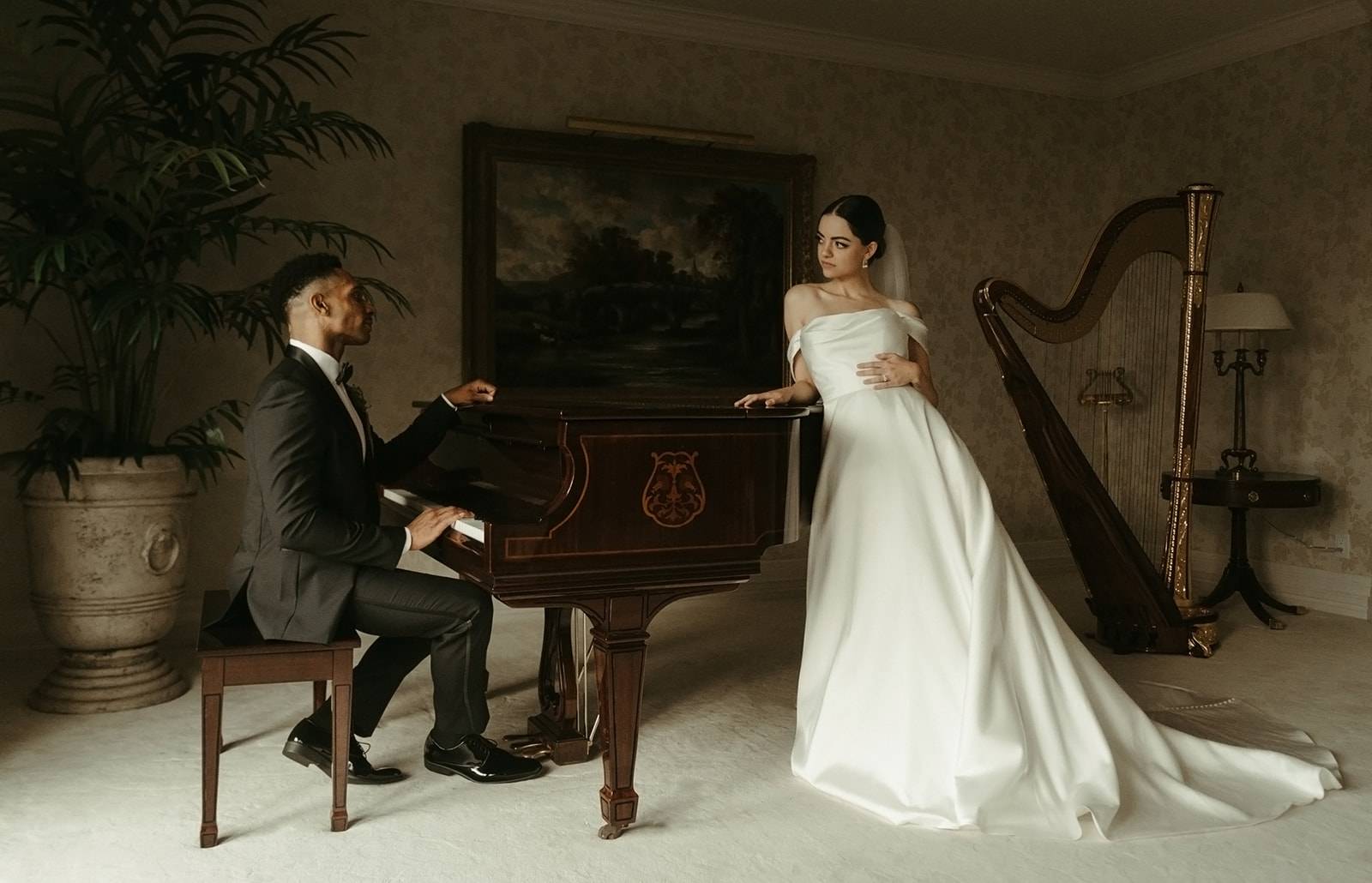 Bride and groom posing at Grand Piano