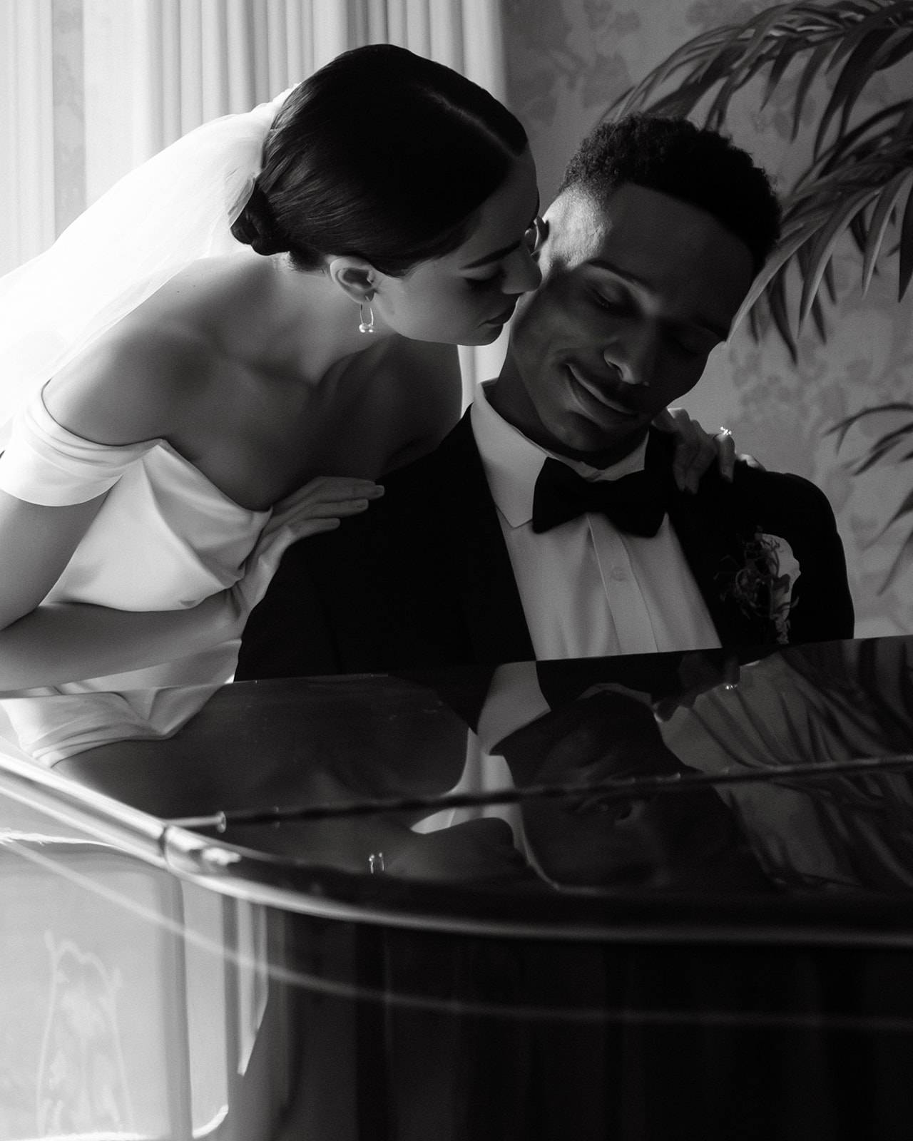 Bride and groom stealing a quiet moment in the music room